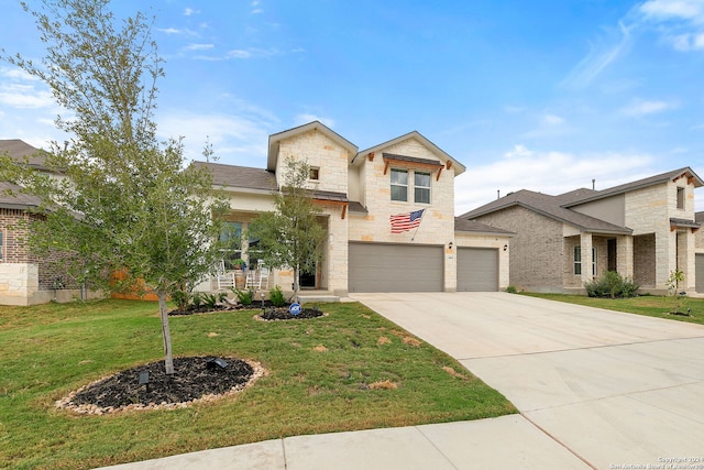 view of front of house featuring a garage and a front yard