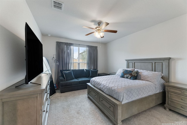 bedroom featuring ceiling fan and light colored carpet