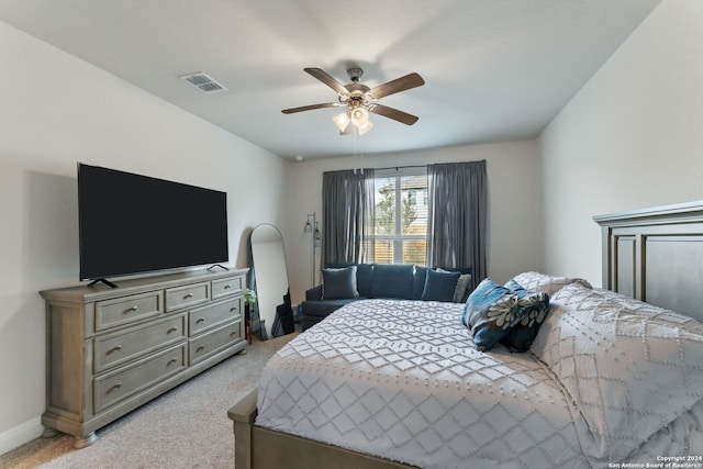 bedroom featuring light carpet and ceiling fan