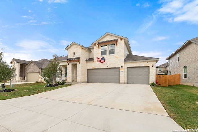 view of front facade with a front yard and a garage