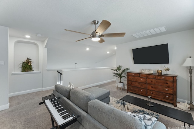 carpeted living room with ceiling fan