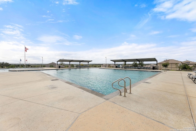 view of swimming pool featuring a patio area