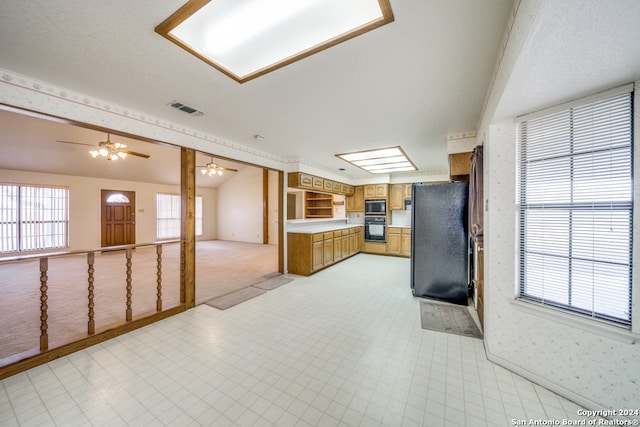 kitchen featuring ceiling fan and black appliances