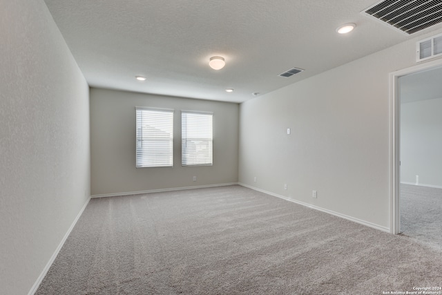 empty room with light colored carpet