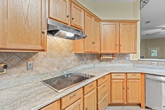 kitchen with black electric stovetop, tasteful backsplash, light stone counters, light tile patterned floors, and dishwasher