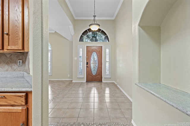 tiled entryway with crown molding