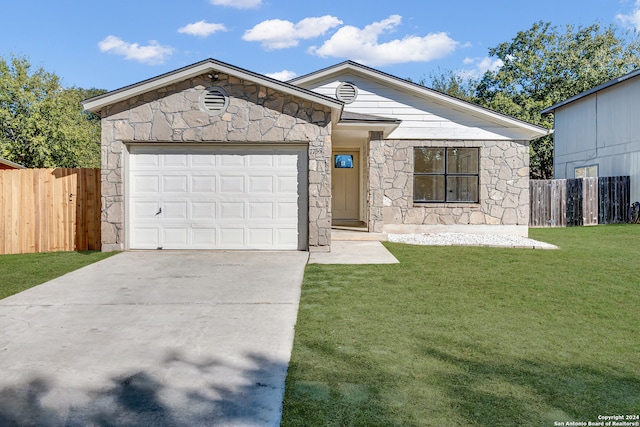 ranch-style home featuring a garage and a front yard