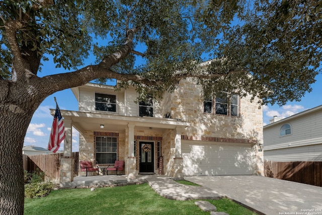 view of front facade featuring covered porch and a garage