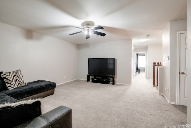 living room with light colored carpet and ceiling fan