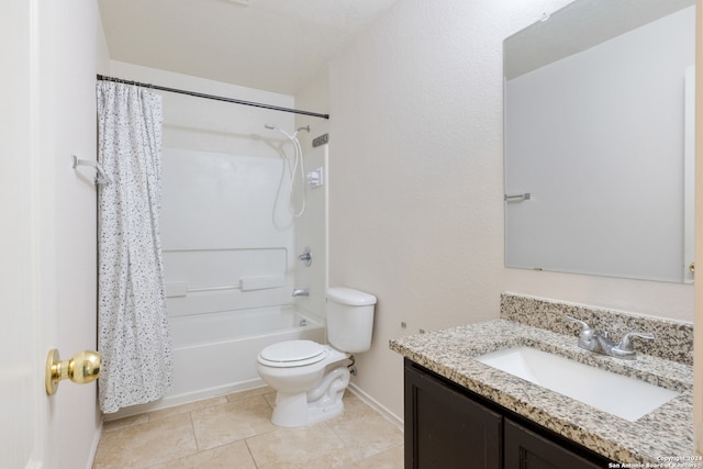 full bathroom featuring baseboards, toilet, tile patterned floors, shower / bath combo with shower curtain, and vanity