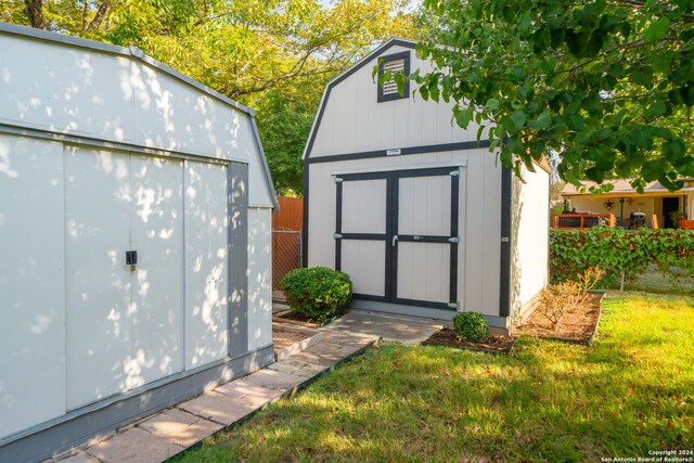 view of outdoor structure with a lawn