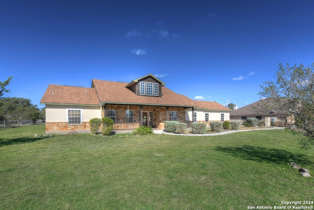 back of house featuring a lawn