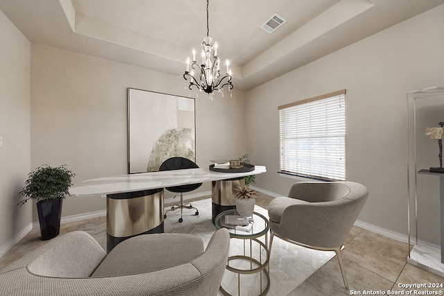 tiled office featuring a notable chandelier and a tray ceiling