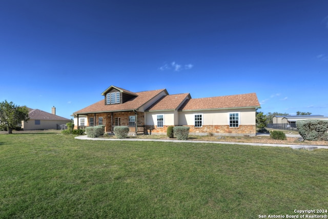 view of front of home with a front lawn