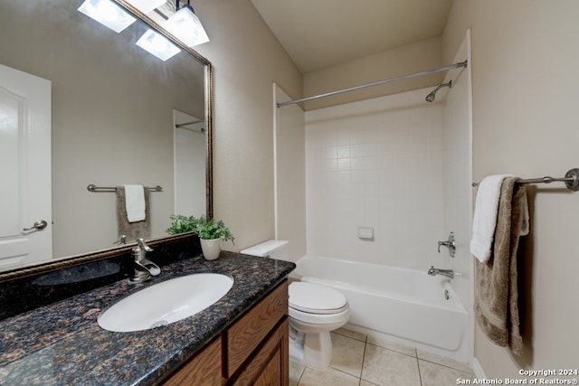 full bathroom with tile patterned flooring, vanity,  shower combination, and toilet