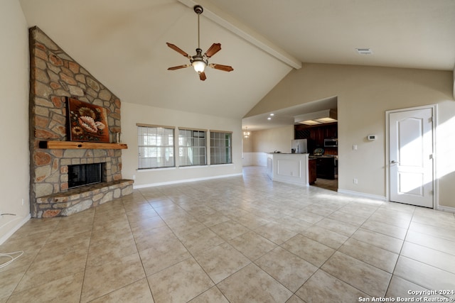 unfurnished living room featuring beamed ceiling, ceiling fan, light tile patterned floors, and a fireplace