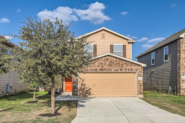 front of property with a front yard and a garage