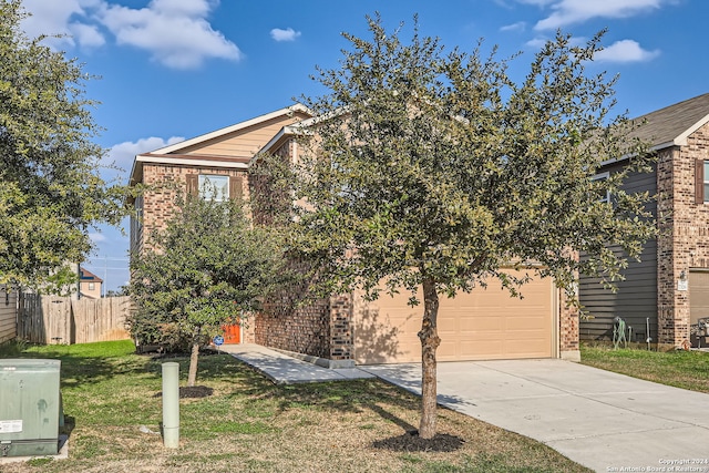 view of property hidden behind natural elements with a front lawn