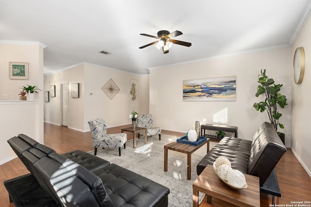 living room featuring ceiling fan, dark hardwood / wood-style floors, and ornamental molding