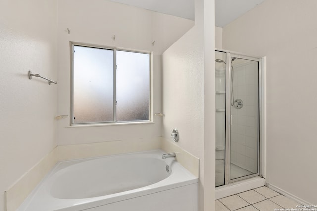 bathroom featuring tile patterned flooring and independent shower and bath