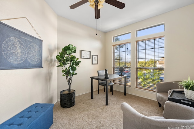 office space with ceiling fan and light colored carpet