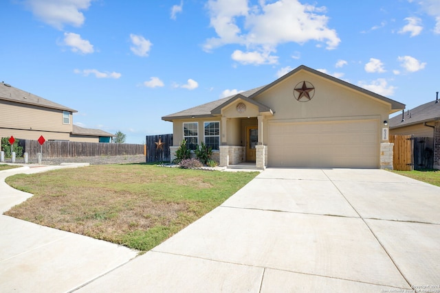 view of front of house with a garage and a front lawn