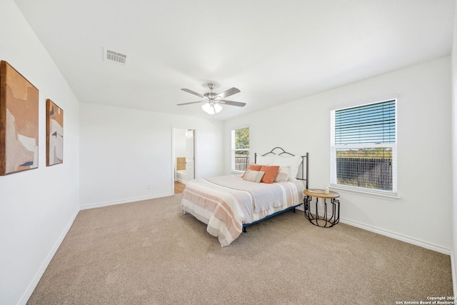 bedroom featuring ceiling fan and light colored carpet