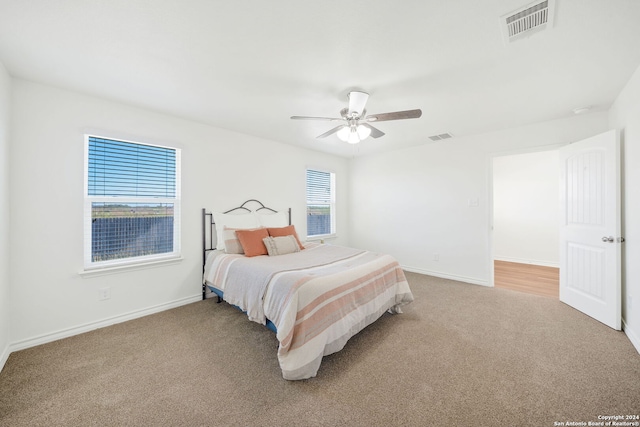 carpeted bedroom featuring ceiling fan