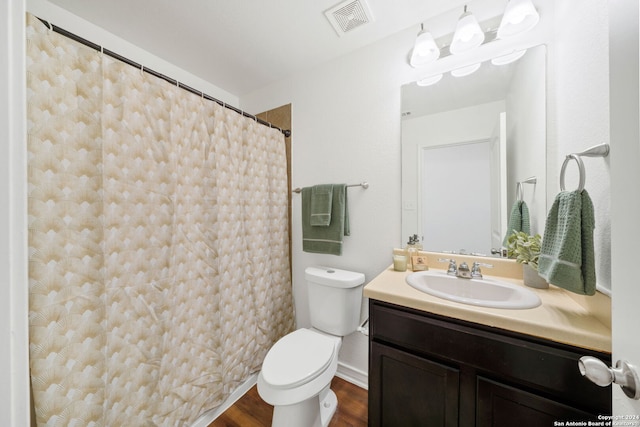 bathroom with a shower with shower curtain, vanity, toilet, and wood-type flooring