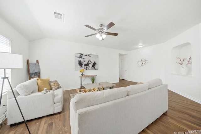 living room with lofted ceiling, ceiling fan, and dark hardwood / wood-style floors