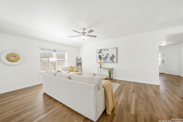 living room with ceiling fan and wood-type flooring