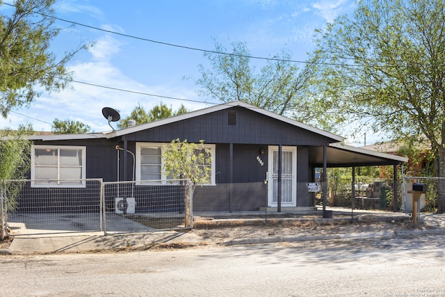 view of front of home featuring a carport