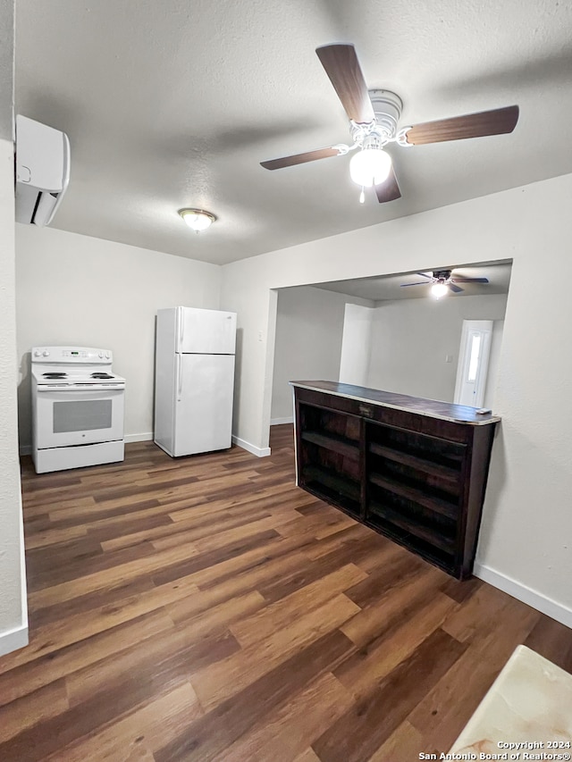 interior space with a textured ceiling, white appliances, dark hardwood / wood-style floors, and ceiling fan