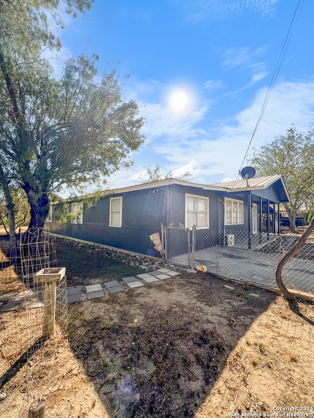 back of property with a patio