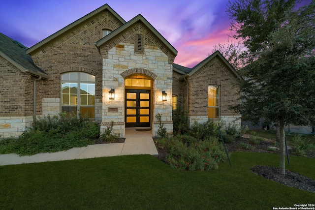 french provincial home with a yard