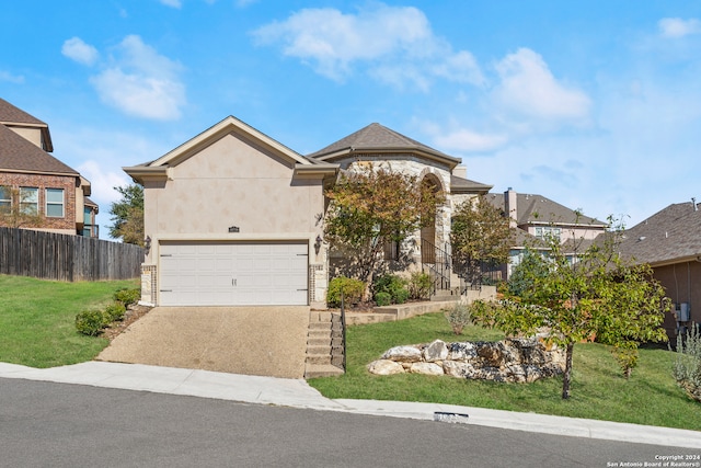 view of front facade with a garage and a front lawn