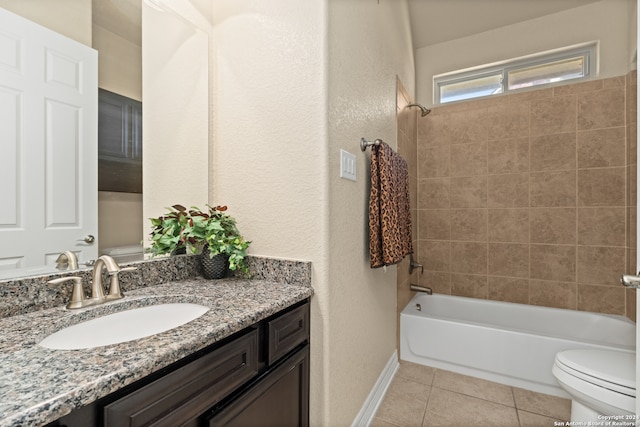 full bathroom featuring tile patterned flooring, vanity, toilet, and tiled shower / bath