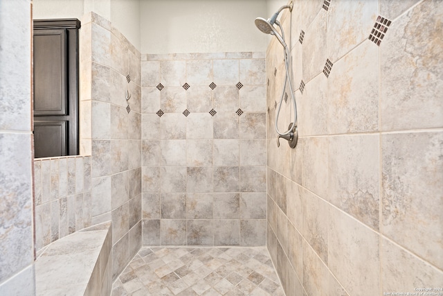 bathroom with a tile shower