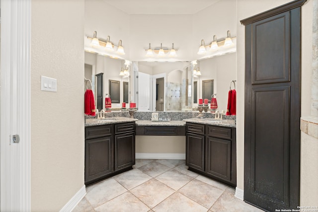 bathroom with tile patterned flooring and vanity