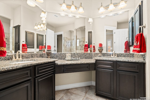 bathroom featuring a shower, vanity, and tile patterned floors