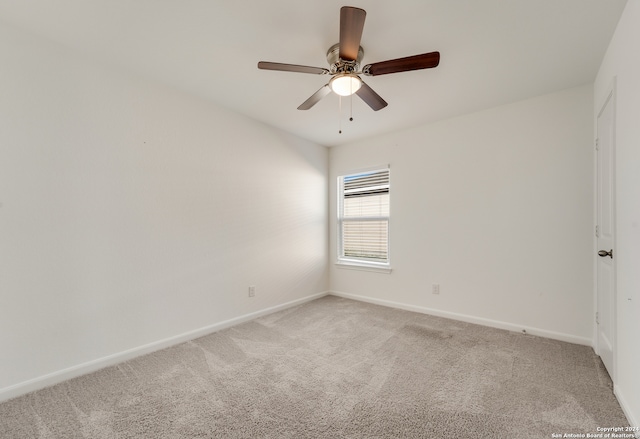 carpeted empty room with ceiling fan