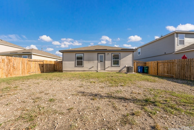 rear view of property featuring cooling unit