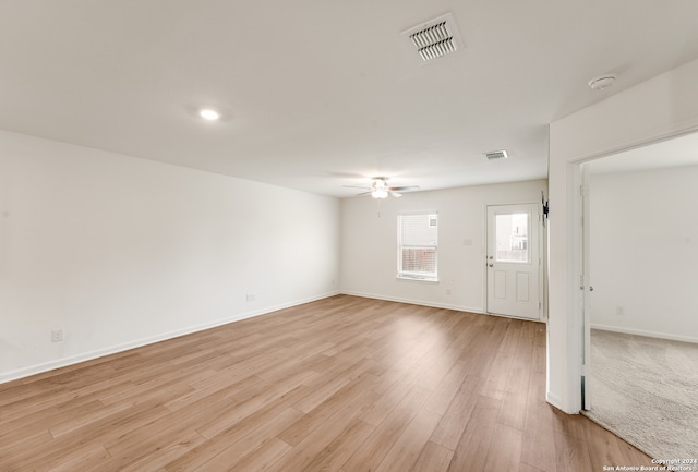 interior space with ceiling fan and light wood-type flooring