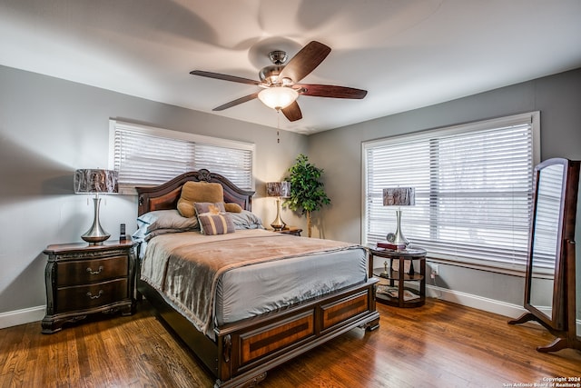 bedroom featuring ceiling fan and dark wood-type flooring