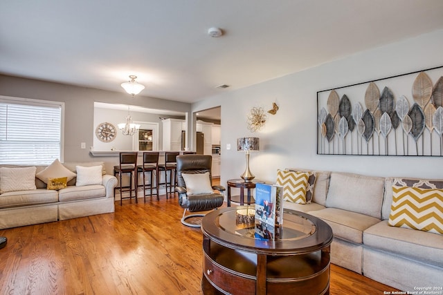 6531 Fox Run, San Antonio, TX 78233 - living room with a chandelier and light wood-type flooring