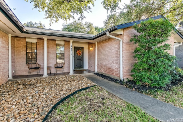 doorway to property featuring a porch