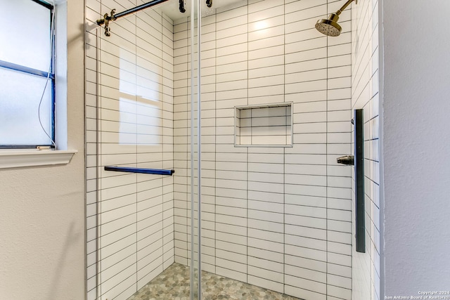 bathroom featuring an enclosed shower