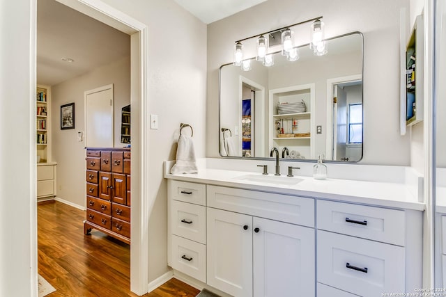 bathroom featuring hardwood / wood-style floors and vanity