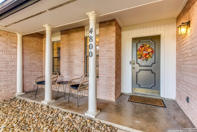 doorway to property with a porch