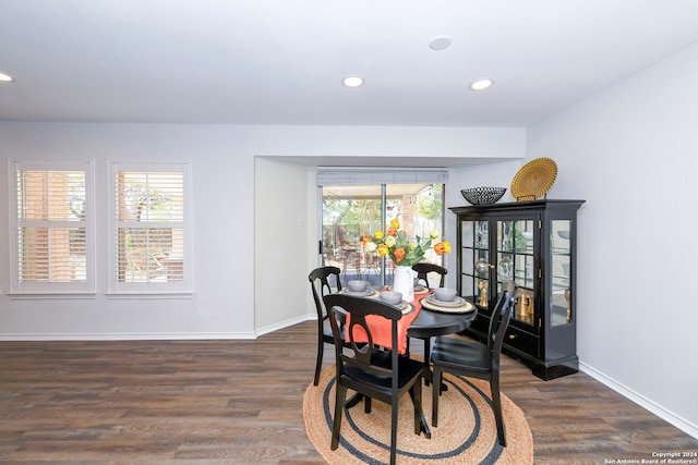 dining area featuring dark hardwood / wood-style floors and a healthy amount of sunlight